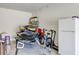 Garage with jet ski, bikes and extra refrigerator at 9248 Hanging Vine Ct, Orlando, FL 32836