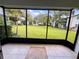 Screened patio overlooking a lush green lawn at 4407 S Semoran Blvd # 2, Orlando, FL 32822