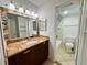 Bathroom with granite vanity and shower access at 4407 S Semoran Blvd # 2, Orlando, FL 32822