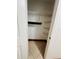 Well-lit pantry with wire shelving for ample storage at 4407 S Semoran Blvd # 2, Orlando, FL 32822