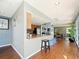 Community kitchen with a breakfast bar and modern appliances at 4407 S Semoran Blvd # 2, Orlando, FL 32822