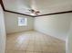 Spacious bedroom with tile floors and ceiling fan at 4407 S Semoran Blvd # 2, Orlando, FL 32822