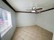 Bright bedroom with tile floors and window blinds at 4407 S Semoran Blvd # 2, Orlando, FL 32822