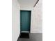 Condo entryway with teal door and welcome mat at 4407 S Semoran Blvd # 2, Orlando, FL 32822