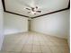 Bright bedroom with tile floors and ceiling fan at 4407 S Semoran Blvd # 2, Orlando, FL 32822
