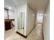 Clean bathroom with granite vanity and tiled floors at 4407 S Semoran Blvd # 2, Orlando, FL 32822
