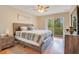 Bedroom with wood floors and sliding door to balcony at 8447 Crystal Cove Loop, Kissimmee, FL 34747