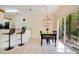 Casual dining area with table and chairs, near sliding doors at 8447 Crystal Cove Loop, Kissimmee, FL 34747