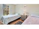 Bedroom with two twin beds and wood floors at 8447 Crystal Cove Loop, Kissimmee, FL 34747