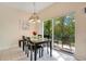 Bright dining area with table and chairs, near sliding doors at 8447 Crystal Cove Loop, Kissimmee, FL 34747