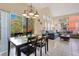 Dining area with table and chairs and view into living room at 8447 Crystal Cove Loop, Kissimmee, FL 34747
