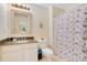 Bathroom with granite countertop and shower/tub combo at 8447 Crystal Cove Loop, Kissimmee, FL 34747
