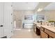 Spa-like bathroom with double vanity and a large soaking tub at 18357 Mowry Ct, Orlando, FL 32827