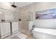 Elegant bathroom with walk-in shower and soaking tub at 18357 Mowry Ct, Orlando, FL 32827