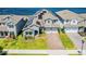 Two story house with solar panels and a view of the lake at 18357 Mowry Ct, Orlando, FL 32827