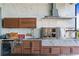 High-end outdoor kitchen with grill and beverage cooler at 18357 Mowry Ct, Orlando, FL 32827