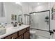 Clean bathroom with a tub, shower, and modern vanity at 18357 Mowry Ct, Orlando, FL 32827