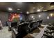 Luxurious home theater with reclining seats and large screen at 18357 Mowry Ct, Orlando, FL 32827