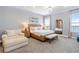 Spacious main bedroom with sitting area and water views at 18357 Mowry Ct, Orlando, FL 32827