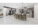 Modern kitchen with gray cabinets, marble floors and island with seating at 18357 Mowry Ct, Orlando, FL 32827