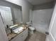 Bathroom boasts granite vanity and a shower/tub combo at 4132 Versailles Dr # 4132D, Orlando, FL 32808