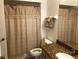 Clean bathroom with shower/tub combo and granite at 474 S Pin Oak Pl # 108, Longwood, FL 32779