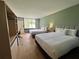 Bedroom with two double beds and built-in shelving at 5245 W Irlo Bronson Memorial Hwy # 154, Kissimmee, FL 34746