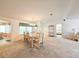 Bright dining room with a view to the kitchen and living room at 6604 Scenic Point Se Dr, Winter Haven, FL 33884