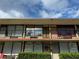 Two-story building exterior with balconies and landscaping at 7900 S Orange Blossom Trl # 2097, Orlando, FL 32809