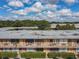 Aerial view of a large apartment complex with a parking lot and landscaping at 7900 S Orange Blossom Trl # 2097, Orlando, FL 32809