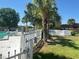 Community pool area with surrounding landscaping and a white fence at 7900 S Orange Blossom Trl # 2097, Orlando, FL 32809