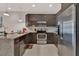 Modern kitchen with stainless steel appliances and granite counters at 17317 Serenidad Blvd, Clermont, FL 34714