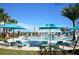 Resort-style pool with lounge chairs and umbrellas at 2412 Dubai St, Kissimmee, FL 34747