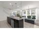 Kitchen island with granite countertop and seating for four at 2412 Dubai St, Kissimmee, FL 34747