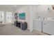 Convenient laundry room with washer and dryer at 2412 Dubai St, Kissimmee, FL 34747