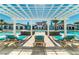 Relaxing pool area with pergola and lounge chairs at 2412 Dubai St, Kissimmee, FL 34747