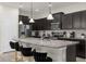 Modern kitchen with granite countertops and stainless steel appliances at 2412 Dubai St, Kissimmee, FL 34747