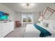Spacious main bedroom with a king bed and ample natural light at 2412 Dubai St, Kissimmee, FL 34747
