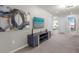 Bright and airy living room featuring a media center and access to other rooms at 2412 Dubai St, Kissimmee, FL 34747
