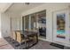 Outdoor patio with a table and chairs, overlooking the pool at 2412 Dubai St, Kissimmee, FL 34747