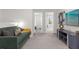 Upstairs landing with comfortable seating and built in media console at 2412 Dubai St, Kissimmee, FL 34747