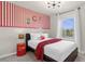 Charming bedroom with Coca-Cola themed decor and comfortable bed at 2412 Dubai St, Kissimmee, FL 34747