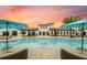 Resort-style pool with lounge chairs and umbrellas at 2412 Dubai St, Kissimmee, FL 34747