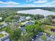 Community overview showcasing waterfront property and mature trees at 245 W George Ave, Maitland, FL 32751