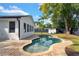 Freeform swimming pool with brick patio and lush landscaping at 245 W George Ave, Maitland, FL 32751