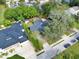 Aerial view of a house surrounded by trees and a street at 245 W George Ave, Maitland, FL 32751
