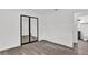 Bedroom with mirrored closet doors and access to a bathroom at 245 W George Ave, Maitland, FL 32751