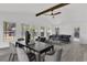 Bright and spacious living area with a dining area and backyard access at 245 W George Ave, Maitland, FL 32751
