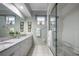 Bathroom with double vanity, granite countertop, and a shower/tub combo at 4040 Palma Ceia Cir, Winter Haven, FL 33884
