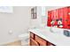 Clean bathroom with a single sink vanity and shower/tub combo at 2610 Calistoga Ave, Kissimmee, FL 34741